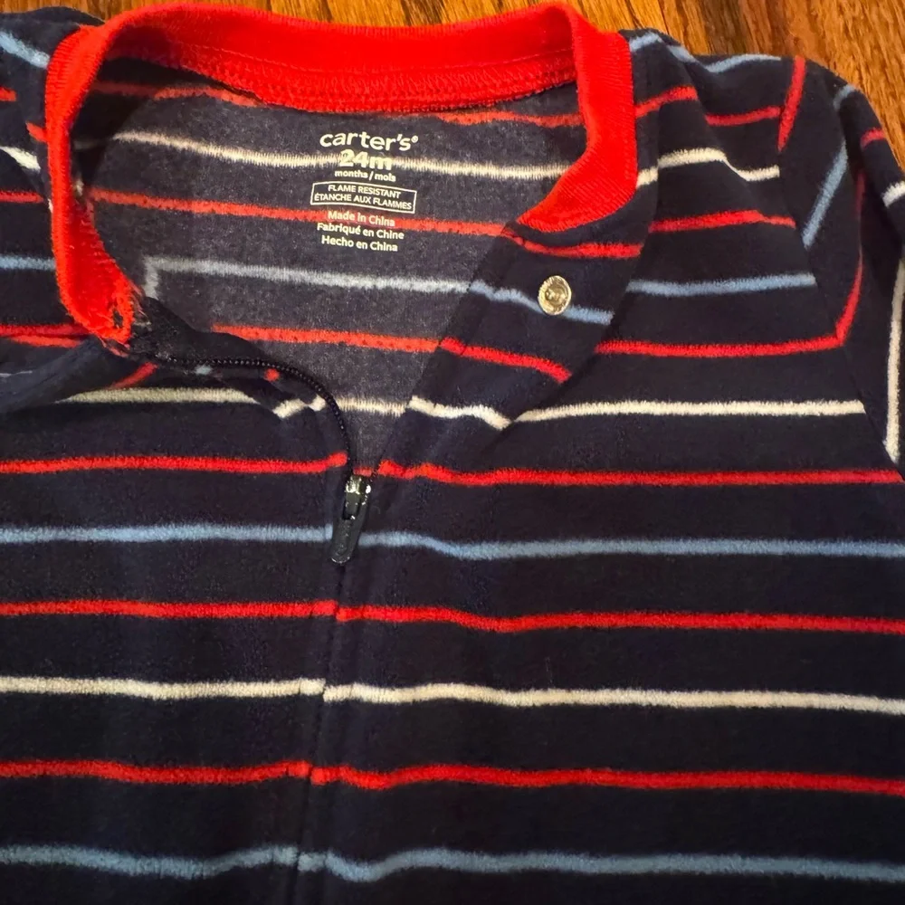 Pair of Carter's fleece PJs with zipper and footies.  Size 24 Months